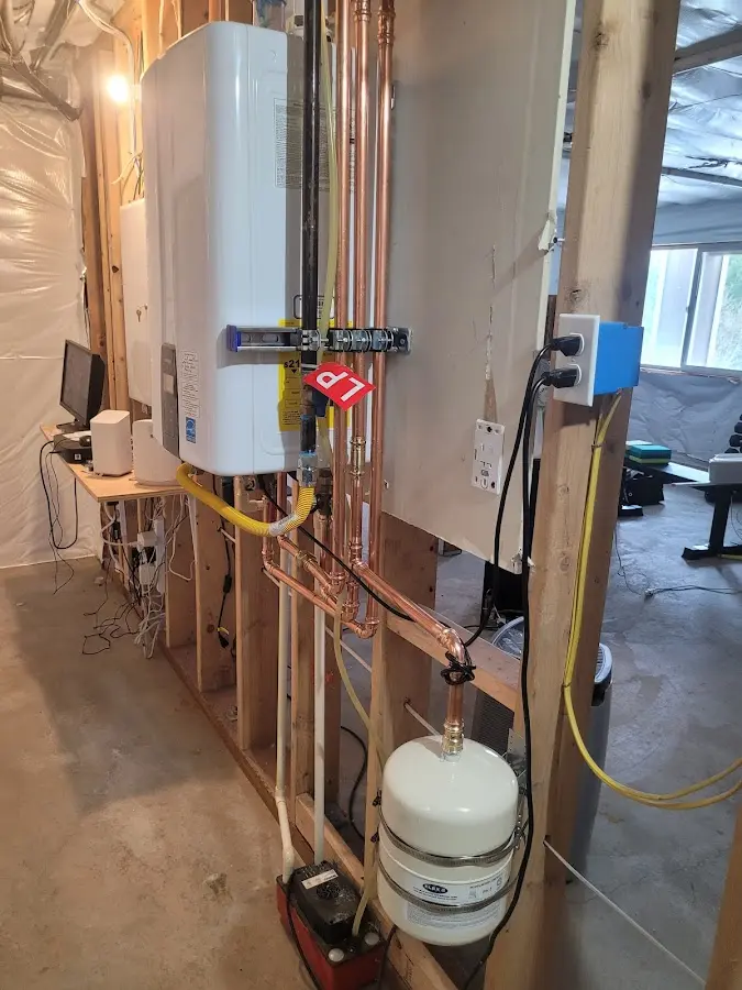 Licensed plumber repairing a kitchen sink in Vernon